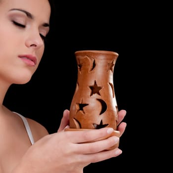 Woman holding an incense burner
