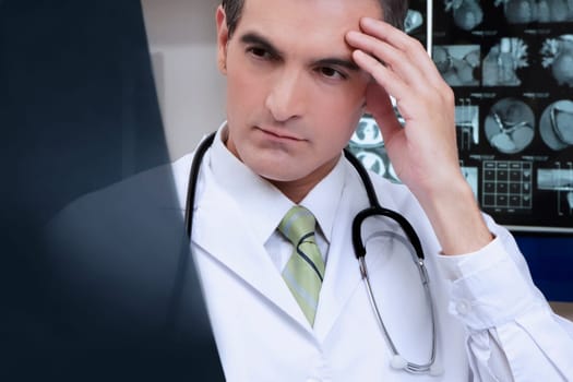 Doctor examining an x_ray report