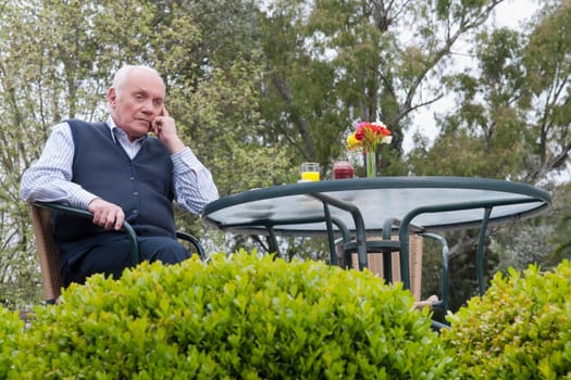 Man sitting in a garden and thinking