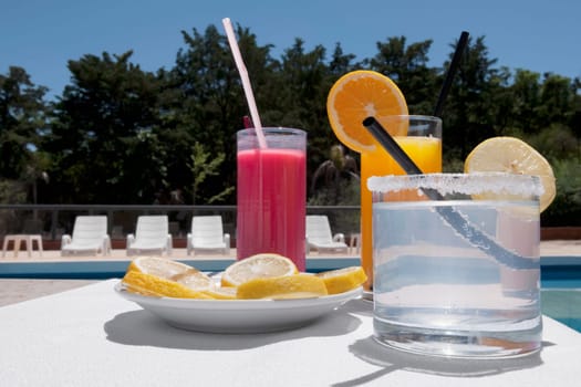 Close_up of assorted drinks at the poolside