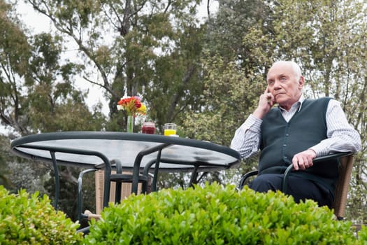 Man sitting in a garden and thinking