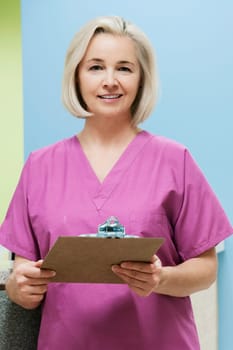Female nurse holding a clipboard