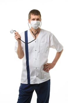 Doctor in mask laughs and twirls a phonendoscope in his hand, isolated on white background
