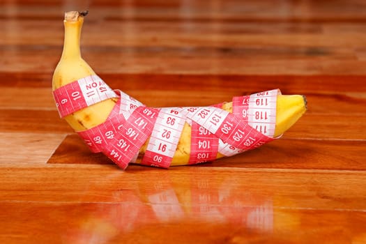 Banana wrapped in a tape measure