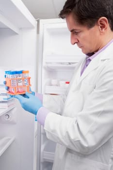 Doctor holding medical samples in a laboratory