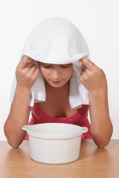 Woman inhaling steam
