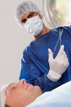 Surgeon with a patient in an operating room