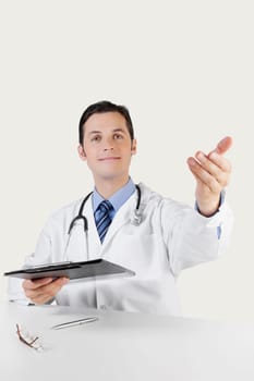 Portrait of a doctor holding a clipboard