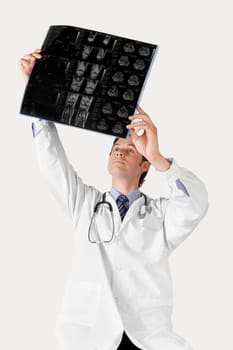 Doctor examining an x_ray report
