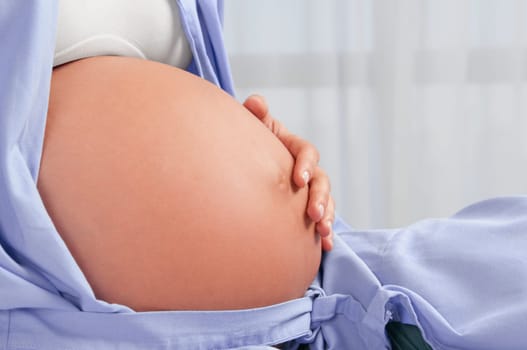Pregnant woman in a hospital bed