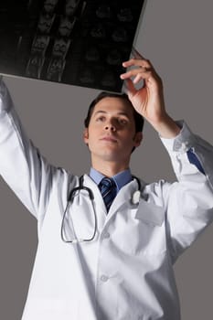 Close_up of a doctor examining an x_ray report