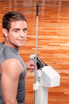 Man measuring his weight on a weighing scale