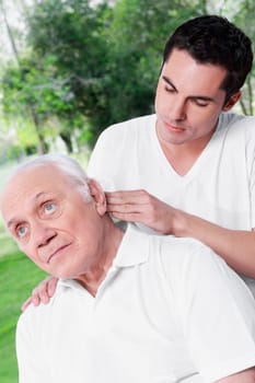 Physiotherapist examining a man