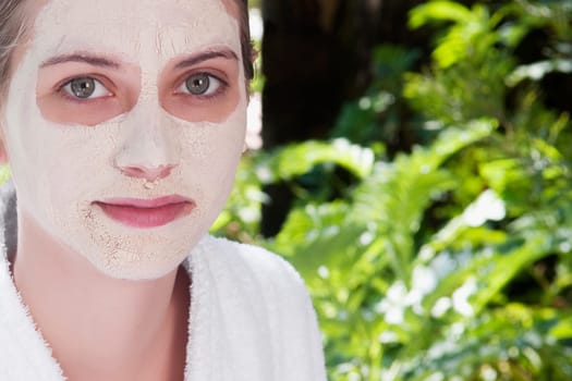 Woman with facial mask on her face