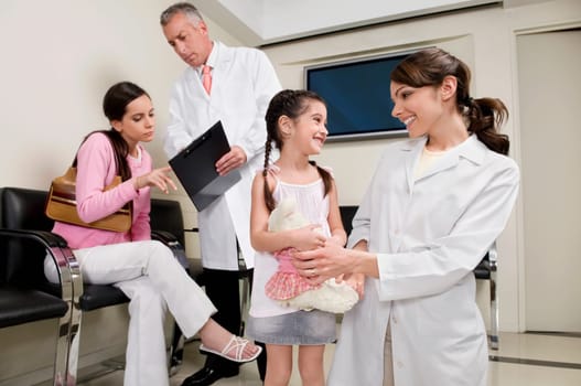 Male and a female doctor with patients
