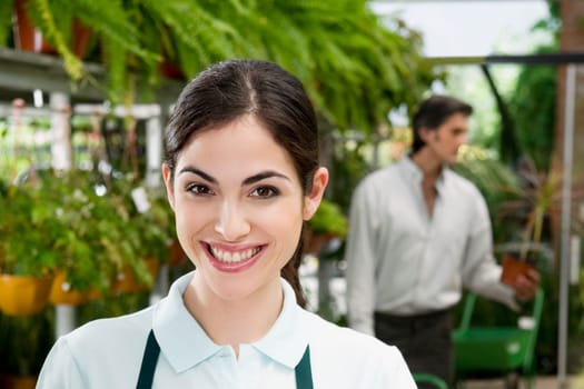 Portrait of a woman in a greenhouse