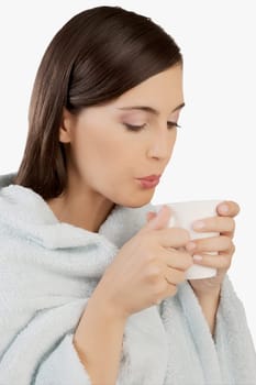 Woman taking hot drink