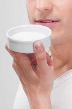Man smelling bath salt