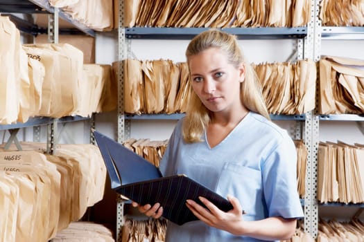 Female doctor reading a file