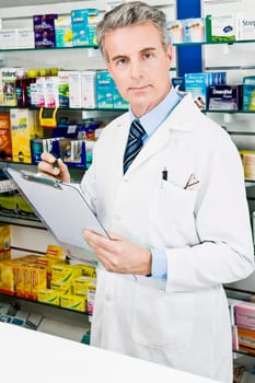 Portrait of a pharmacist holding a clipboard