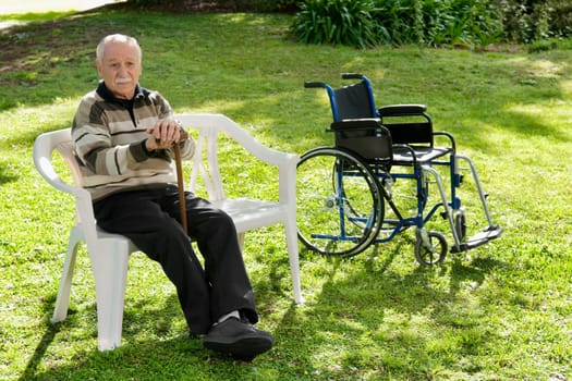 Man sitting on a chair in a park