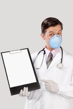 Doctor wearing a flu mask and showing a clip board