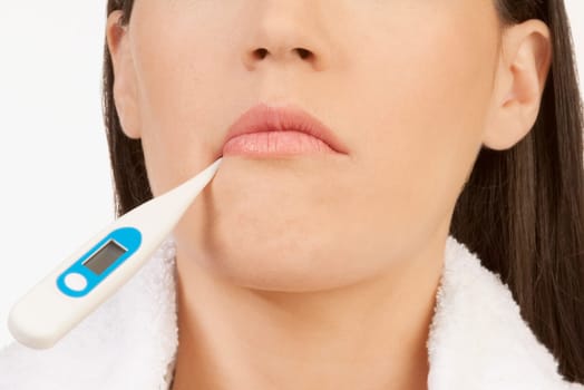 Woman taking her temperature