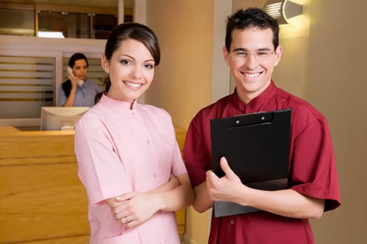 Portrait of a female doctor with a male doctor
