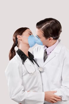 Doctors wearing flu masks and romancing