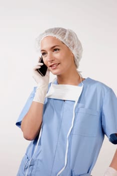 Female nurse talking on a mobile phone