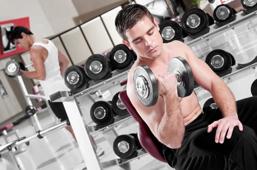Men lifting weights at gym