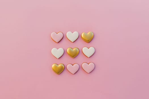 Pink background with sweet gingerbread heart cookies. High quality photo