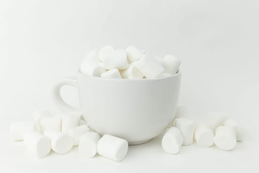 Marshmallow in the cup on the white background. High quality photo