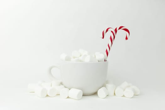 Marshmallow in the cup on the white background. High quality photo