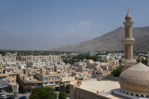 The oasis city of Nizwa is located at the foot of the Hajar Mountains and in the heart of Oman on the Arabian Peninsula.