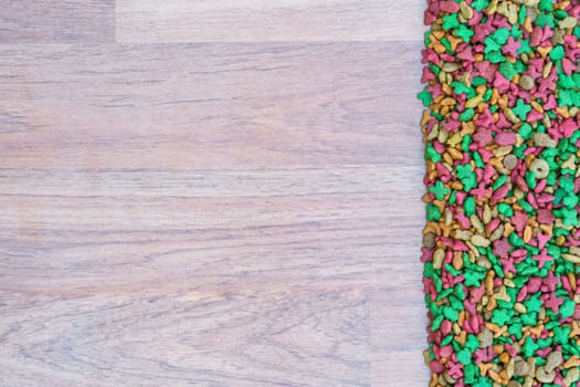 Top view dry cat food on wooden background with copy space