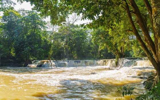 Water falls in tropical rainforest with tree.  Namtok chet saonoi National Park in Thailand