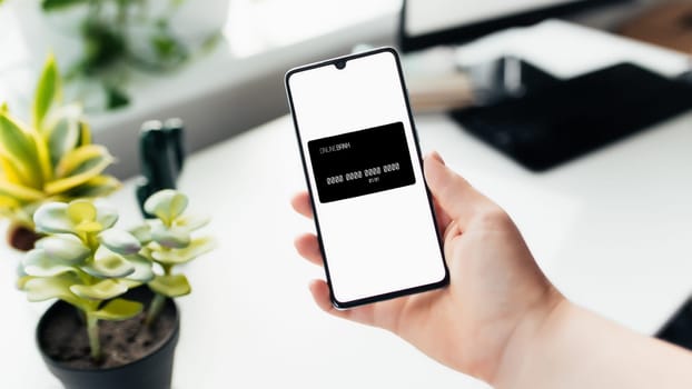Smartphone in the hand, work from home, office stuff. High quality photo