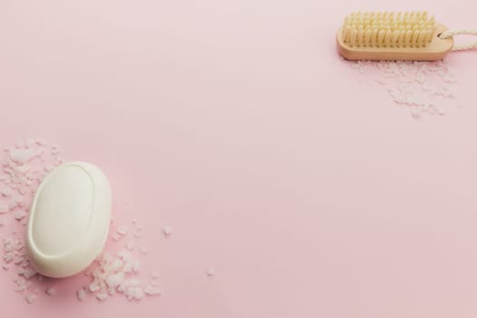 Soap and brush on the pink background. High quality photo