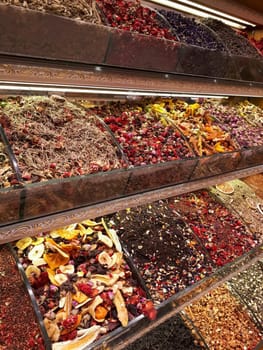 Spices on the counter in the store. A large set of different spices.