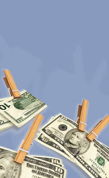Ten dollar bills clipped with clothespins