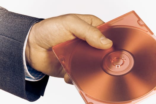 Close_up of a businessmanŽs hand holding a compact disc