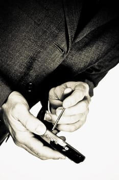 Mid section view of a businessman using a personal data assistant