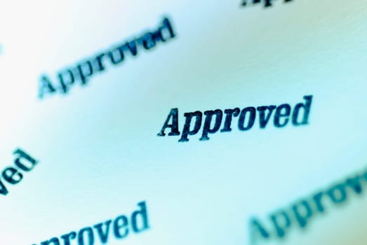 Close_up of text Approved on a paper