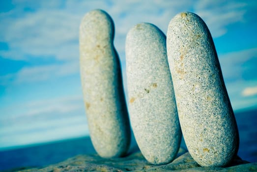 Three pebbles on a rock