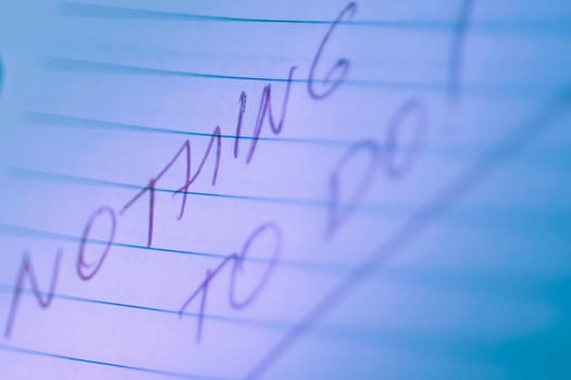 Close_up of text Nothing To do written on a notepad