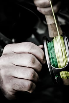 Close_up of a manŽs hand holding a fishing rod