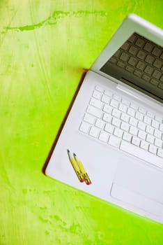 Close_up of pencils on a laptop