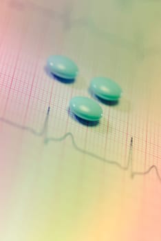 Close_up of tablets on an ECG report