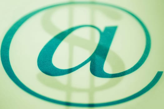 Close_up of at symbol with a dollar sign